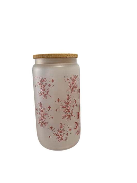 frosted tumbler with floral patterns and a wooden lid on a white background