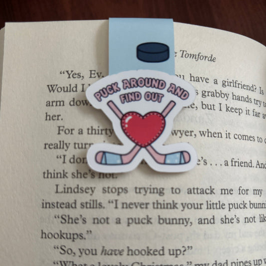 Bookmark with hockey-themed design on an open book